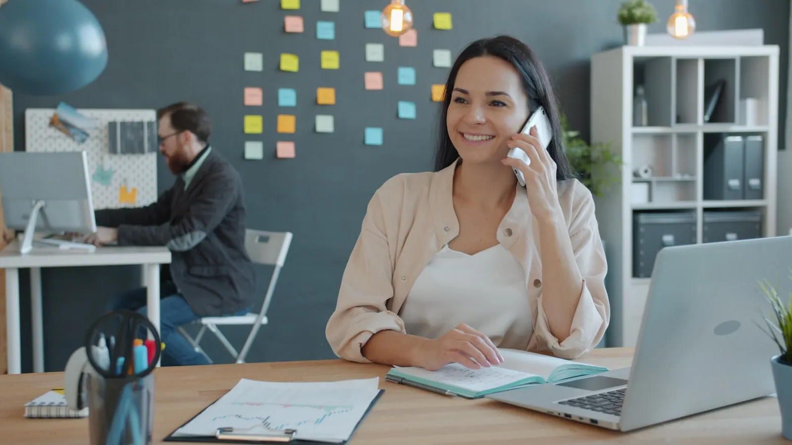 An employee at a desk answering a customer call
